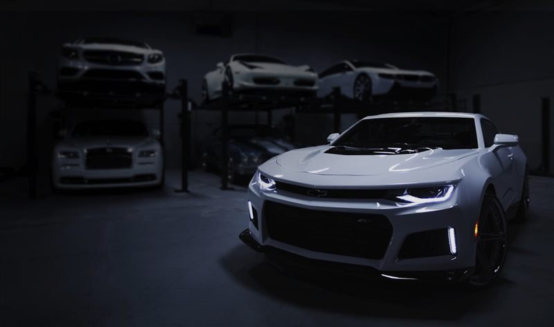 Site da AutoPrime Veículos — showroom escuro com carros premium